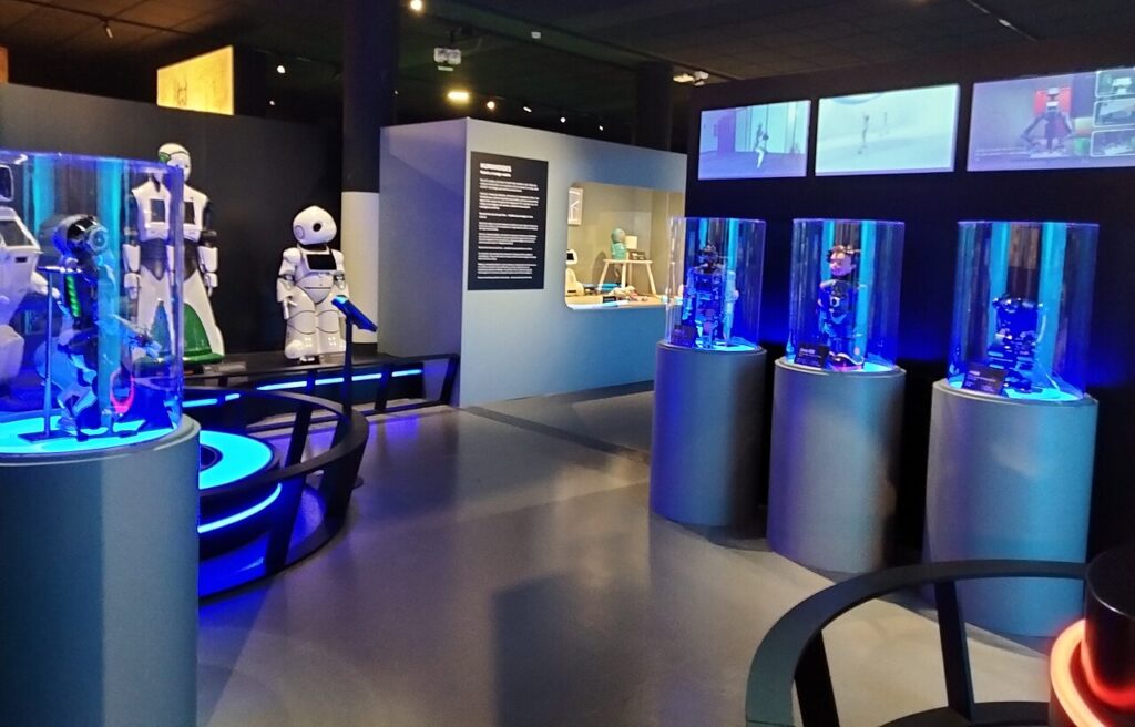 Visitors viewing robots at a technology exhibition