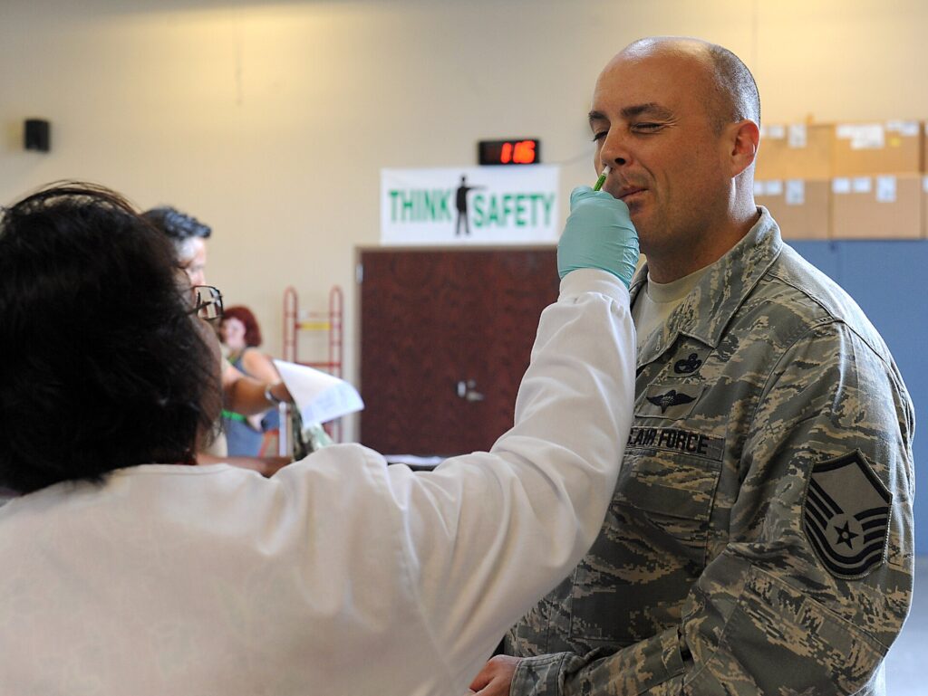 Healthcare worker preparing a measles MMR vaccination dose